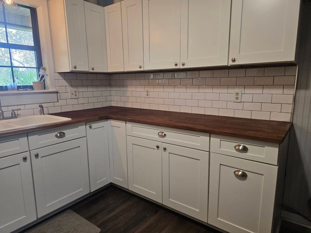 Finished kitchen remodel with white shaker cabinets and subway tile backsplash